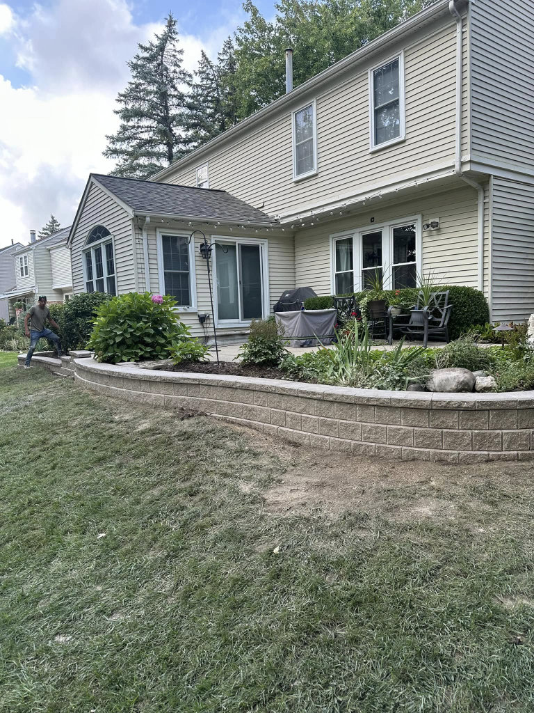 Greener Grounds Landscape brick wall and landscaping.