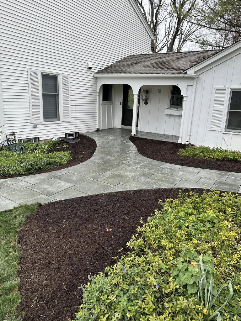 Greener Grounds Landscape brick sidewalk and landscaping.