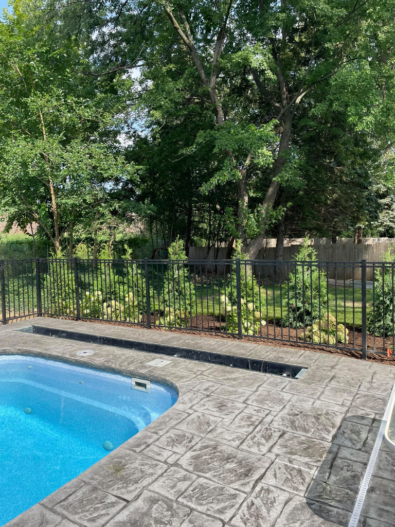Greener Grounds Landscape brick pool decking and landscaping.