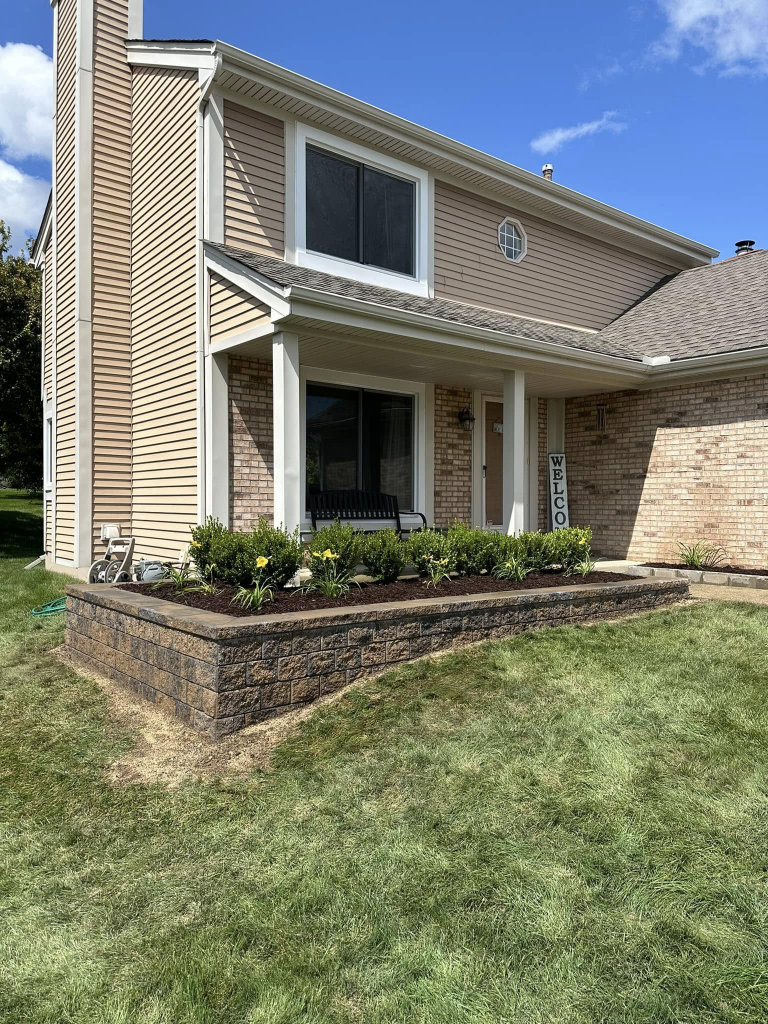 Greener Grounds Landscape brick wall and landscaping.