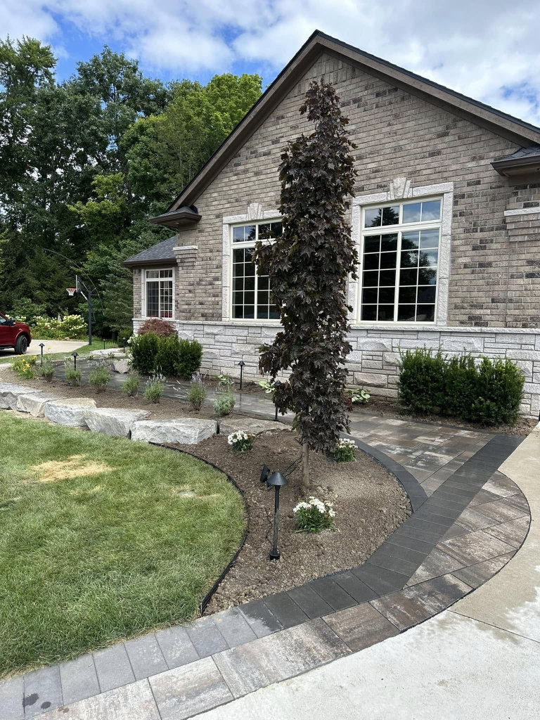 Greener Grounds Landscape stone and brick walkway and landscaping.