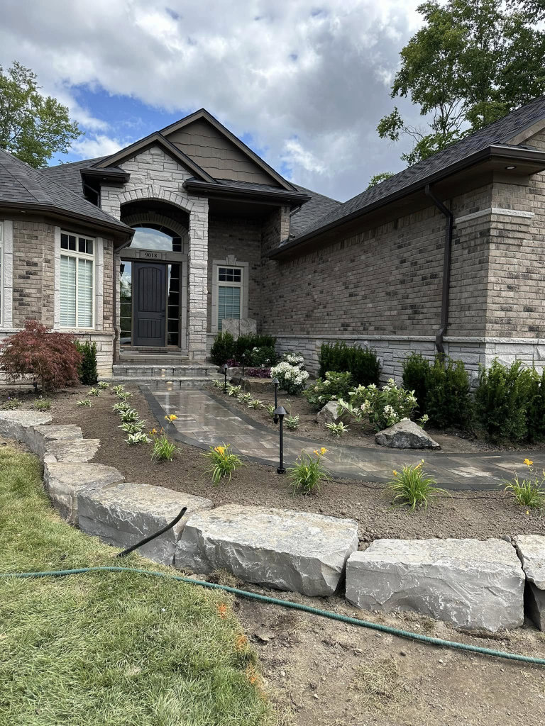 Greener Grounds Landscape stone and brick walkway and landscaping.