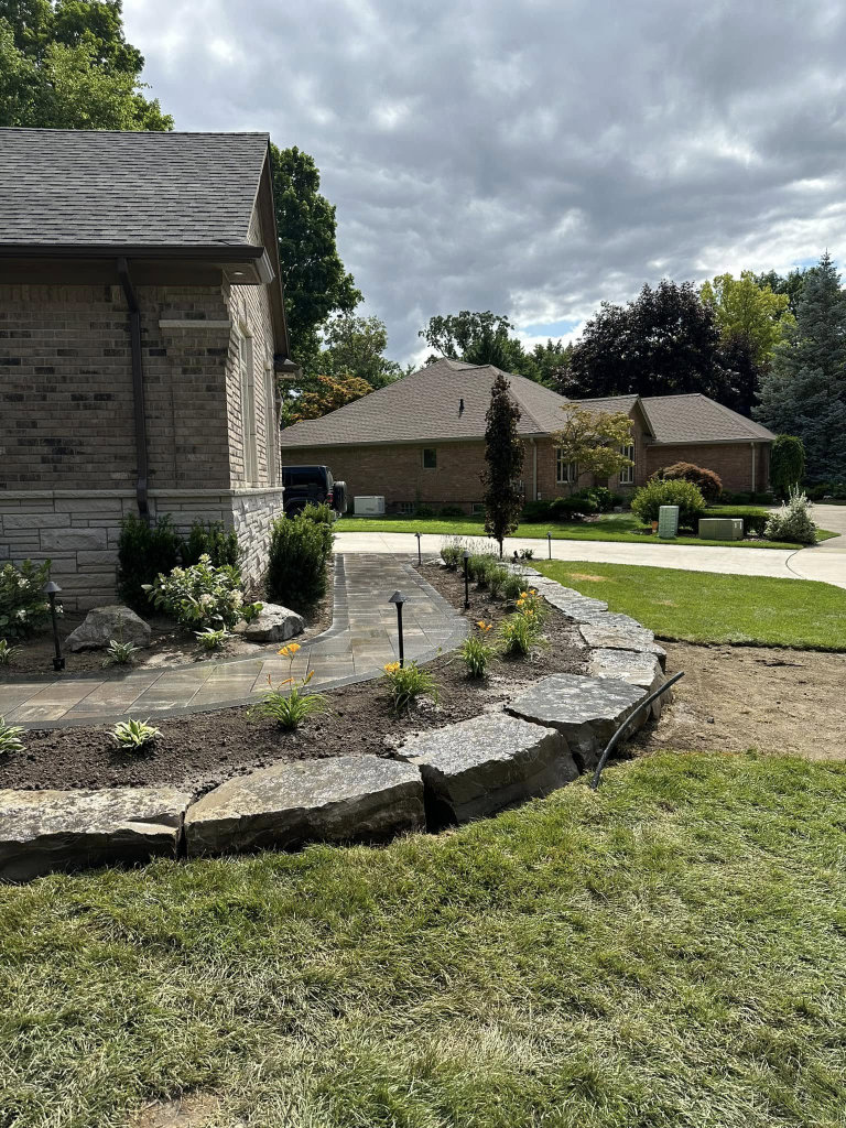 Greener Grounds Landscape stone and brick walkway and landscaping.