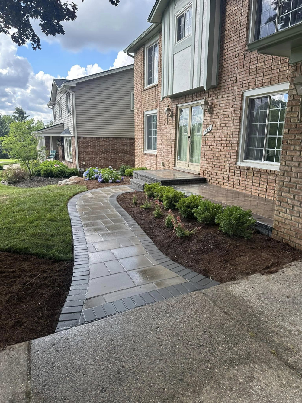 Greener Grounds Landscape brick walkway and landscaping.